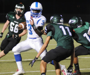 New Kent running back Davion Barnes (3) bolts past Jamestown defenders for some of his 208 rushing yards.