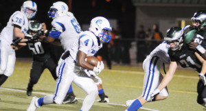 Blockers pave the way for New Kent's R.J. Morris (4) to cut toward the end zone for the deciding two-point conversion.