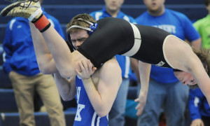 Trojan wrestler Aiden Smith upends his King William opponent on the way to winning a decision at 160 pounds.