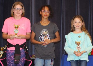 Fourth grade winners are (l to r) Carina Dolci (1st), Lauren Curry (2nd-tied for third overall), and Emily Lamb (3rd).