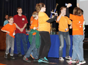 George Watkins Elementary School’s winning team of Morgan Setzer, Colin Pierce, Nathaniel Hager, Russell Hager, Eathan King, Mea Picone and Abbigale Reece happily claim their first place trophy. The team is coached by Dorothy Hager.