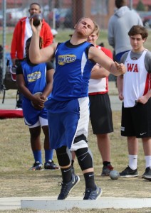 Charles City's Richard Adkins exerts an enormous out of energy on his opening throw in the boys' shot.