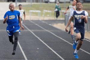 Charles City's Steven Williams tries to make up ground on Varina's Jason Richards in the 200-meter dash.