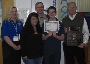 Julian Vogt (second from right) is the recipient of the award at New Kent Middle School. With him during the presentation are (l to r) middle school principal Kelly Gray, mother Shannon Vogt, Watkins, and Rula.