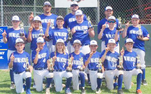 All-stars representing New Kent’s 10YO team holds up the number one sign in celebration after defeating Gloucester 10-2 in the title contest.