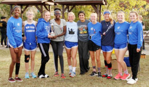 New Kent’s Lady Trojans cross-country team pose for a picture after they claimed the runner-up spot at the 3A regional meet.